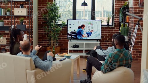 Preview: Cheerful people watching drama tv series on television