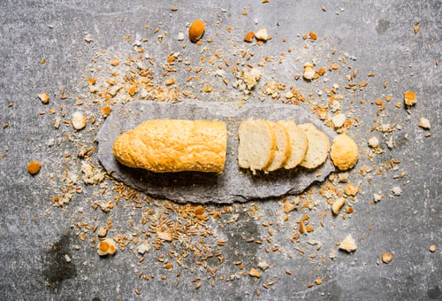 Preview: The ciabatta on a stone stand with crumbs.