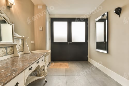 Preview: a large bathroom with a sink and a black door