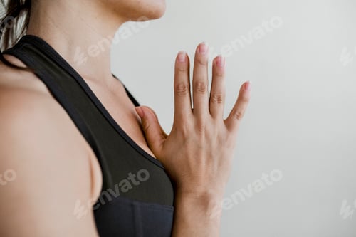 Preview: Sporty woman in Anjali Mudra pose
