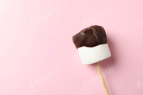 Preview: Marshmallow in chocolate on pink background. Sweet food