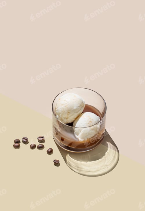 Preview: Affogato coffee with vanilla ice cream scoops and espresso in a glass on a light background