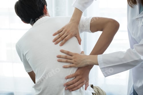 Preview: Female physiotherapists provide physical assistance to male patients with back injuries back massage