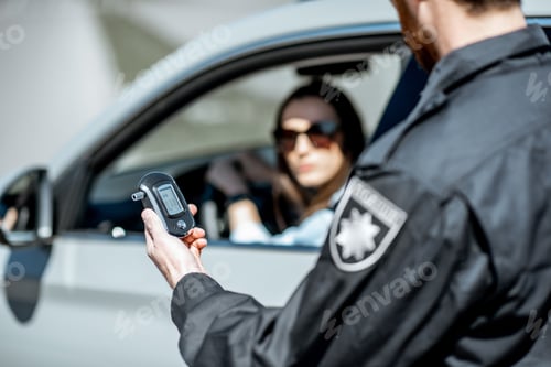 Preview: Policeman with alcotest device