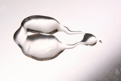 Preview: A smear of cosmetic gel close-up on a gray background. Appetizing texture with bubbles.