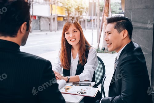 Preview: Group of Business People Teamwork Meeting in Business District Talking about New Project