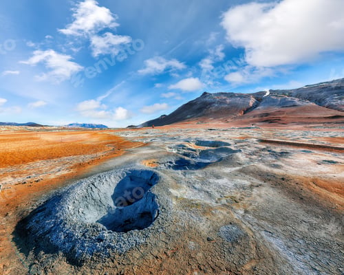Preview: Breathtaking boiling mudpots in geothermal area Hverir and cracked ground around.