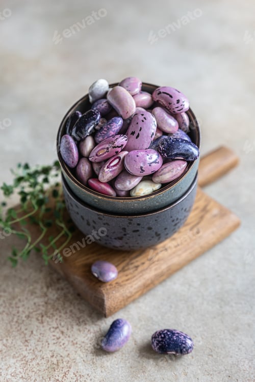 Preview: Ceramic bowl with colorful legumes and thyme,. Vegan high protein product.