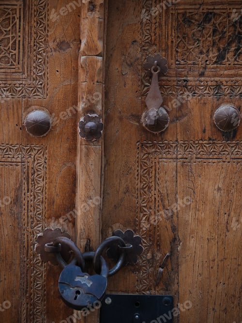 Preview: Textured wooden door with metal rivets