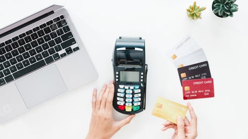 Preview: Top view of Asia lady using laptop online shopping with credit card pay the bill.