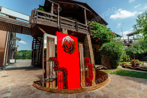 Preview: Wedding decor. the wedding ceremony area in the backyard is decorated with red roses flower