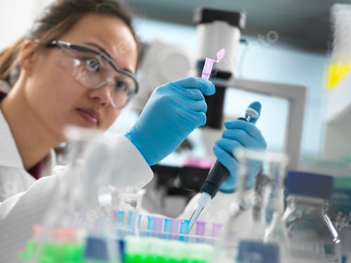 Preview: Scientist pipetting sample into vial for genetic testing in laboratory