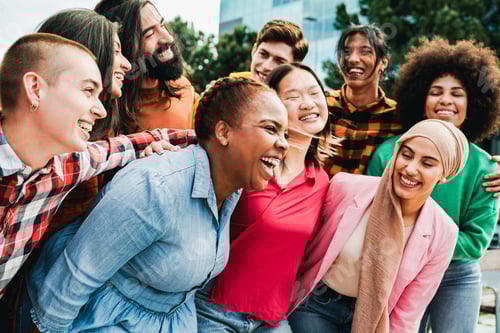 Preview: Diverse group of friends having fun in summer day. Young people celebrate holiday vacations