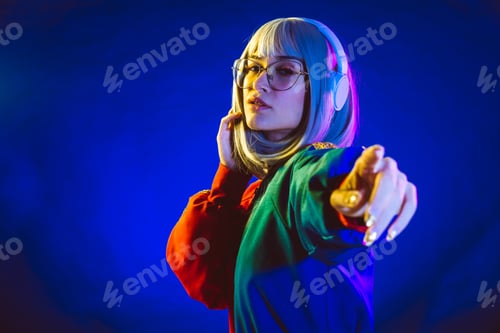 Preview: Young woman with grey hair dancing and celebrate. Colored gel portraits