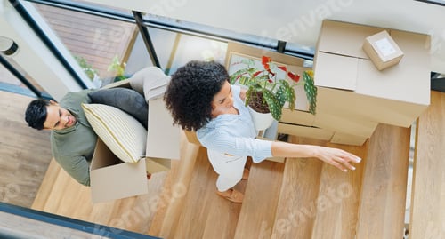 Preview: Couple, moving and above with box by stairs for real estate, investment and packing for new home. M