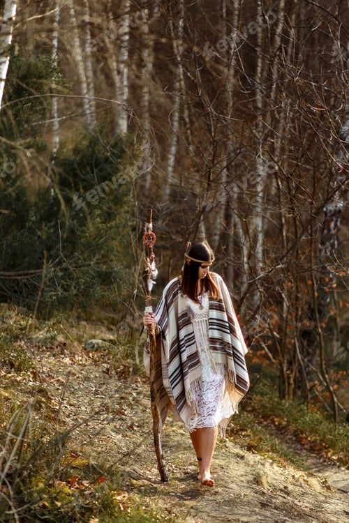 Preview: beautiful native indian american woman holding pikestaff with dream catcher