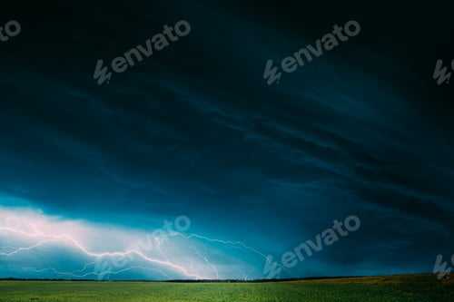 Preview: Countryside Rural Wheat Field Meadow Landscape In Summer Rainy Day. Scenic Sky With Rain Clouds On