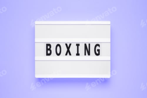 Preview: The word boxing on lightbox isolated blue background.