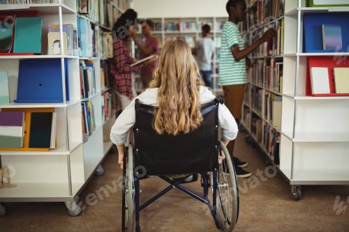 Preview: Disabled girl on wheelchair in library