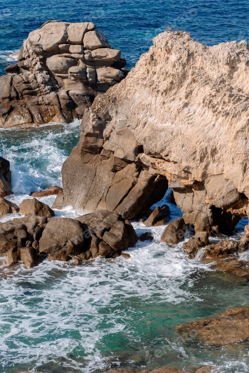 Preview: Waves on rocky beach, sea shore with waves crushing over the big rocks