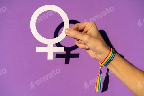 Preview: A woman holding a drawing in a vindication in favor of equality between men and women