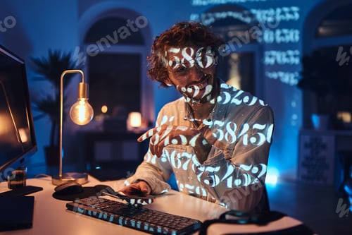 Preview: Joyful office worker looks at camera holding his phone in dark room
