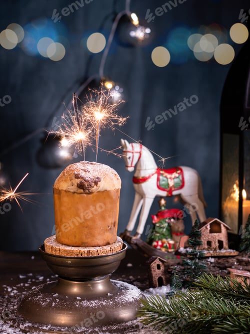 Preview: Christmas sweet panetone dish and Christmas decorations, light blue bokeh