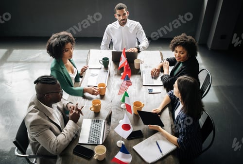 Preview: Diverse Businessmen And Businesswomen Having Corporate Meeting In Modern Office