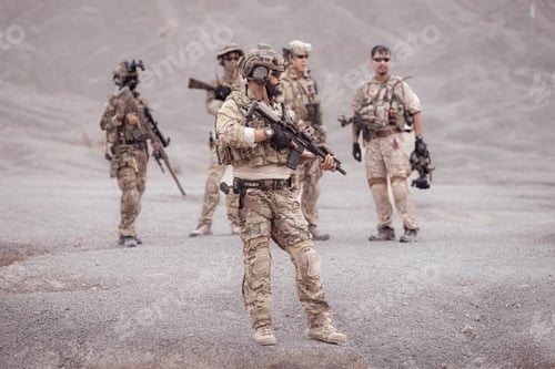 Preview: Soldiers in camouflage military uniforms carrying weapons Reconnaissance missions in rugged mountain