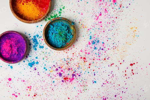 Preview: top view of traditional holi paint in bowls isolated on white, Hindu spring festival of colours