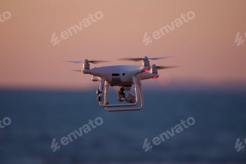 Preview: Awesome drone flying over the ocean through a pink sky