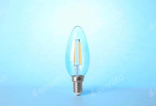 Preview: New modern lamp bulb on light blue background