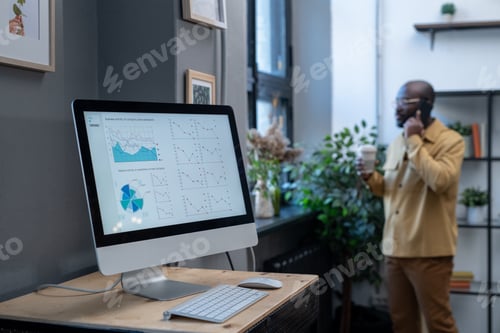 Preview: Computer monitor on desk with digital financial data on screen