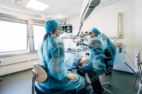 Preview: Team dental surgeons working in dental clinic.