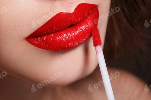 Preview: Closeup of red female lips and lipstick