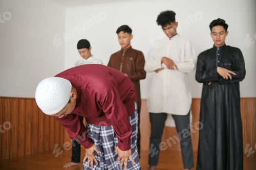 Preview: Muslim Man Leading Salah Gesture Kneeling While The Followers Position Ready To Follow Imam