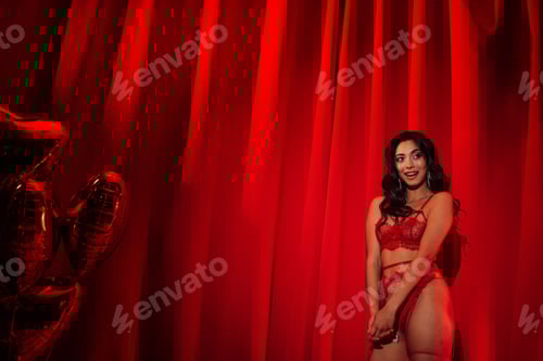Preview: Portrait of beautiful glamour makeup asian sexy smile girl in underwear by red inflatable balloons