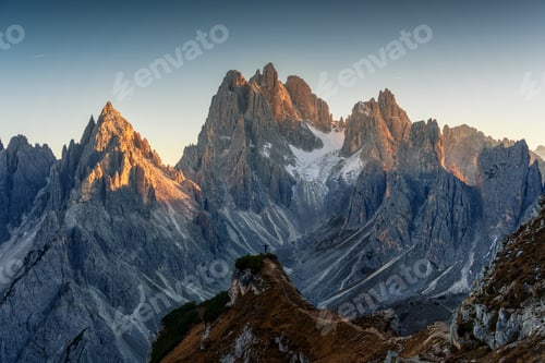 Preview: Alpine landscape of Cadini di Misurina with rugged mountain range during sunset in Dolomites, Italy