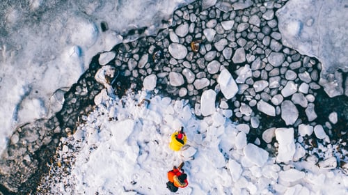 Preview: wanderlust couple of bloggers with cameras taking photo of scenery winter nature