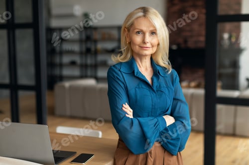 Preview: Confident Woman Posing near Desk Inside Modern Office