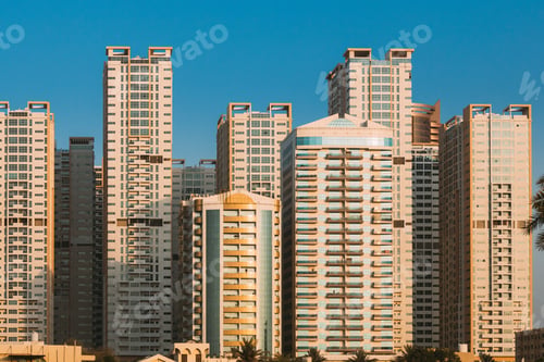 Preview: New Residential Multi-storey Houses. Cityscape Skyline In Sunny Spring Evening On Blue Sky. Real