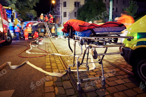 Preview: Accident on the city road at night. Themes emergency services and help.