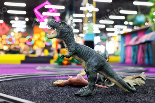 Preview: A toy dinosaur on the floor in the playroom.