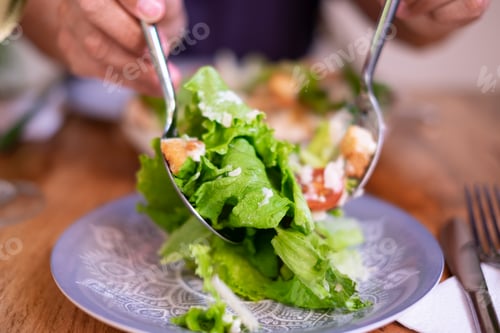 Preview: Traditional Caesar salad with green lettuce, parmesan cheese, chicken, croutons and dressing
