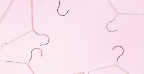 Preview: Creative flat lay hangers pastel pink background. Sale discount store promo shopping concept