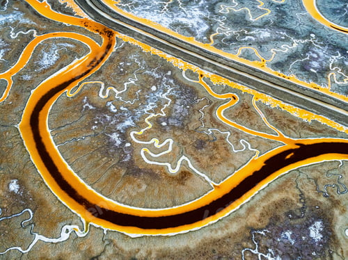 Preview: Salt flats, view from above. A winding road and meandering river