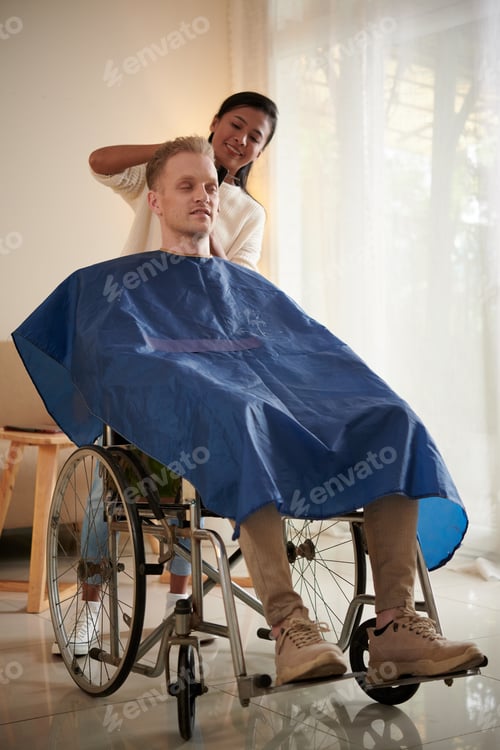 Preview: Hairdresser Cutting Hair of Man with Disability