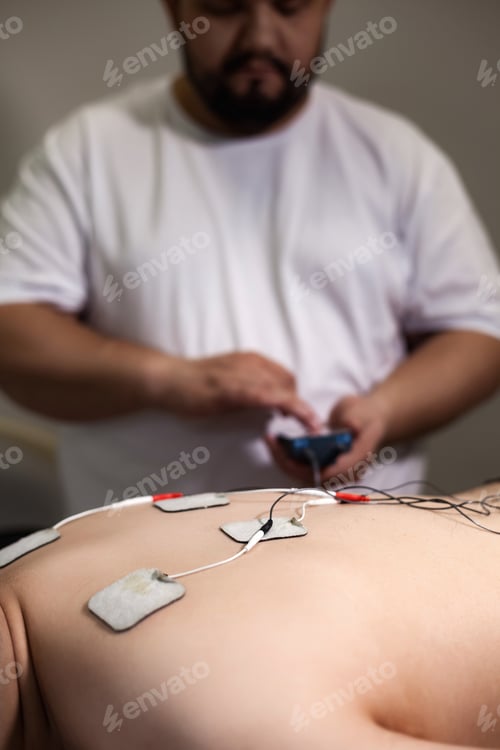 Preview: Therapeutic Session in a Wellness Clinic Focusing on Muscle Recovery and Relaxation Techniques