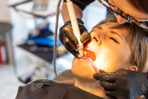 Preview: Woman at the dentist office. Selective focus.