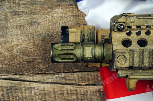 Preview: U.S. battle flag and assault rifle on the wooden table